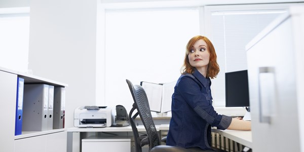 Woman sitting at her office desk