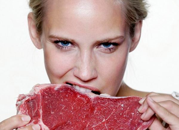 Woman eating raw meat