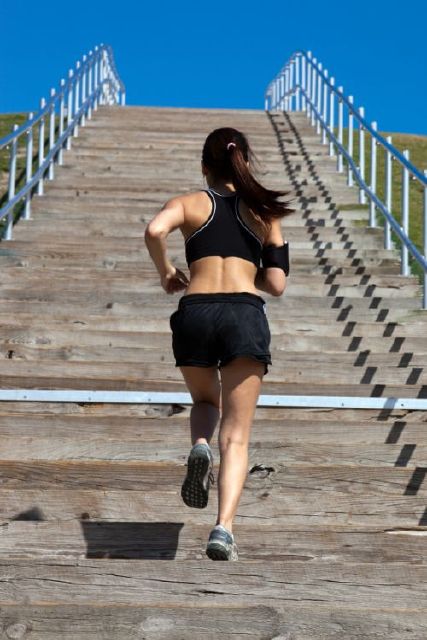 Woman running up the stairs