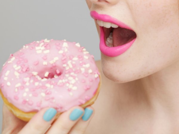 Woman eating a donut
