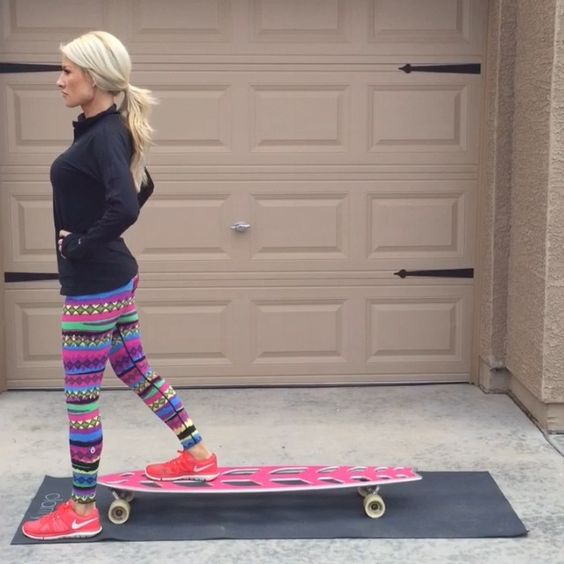 Woman working out with her skateboard